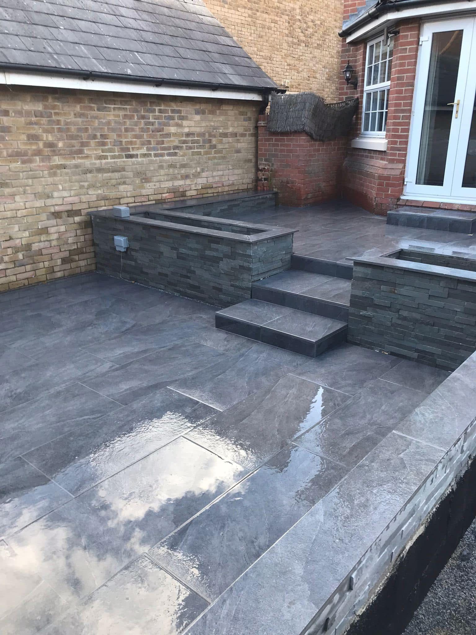 Porcelain paving patio laid in Essex by Andy Harragan & Sons